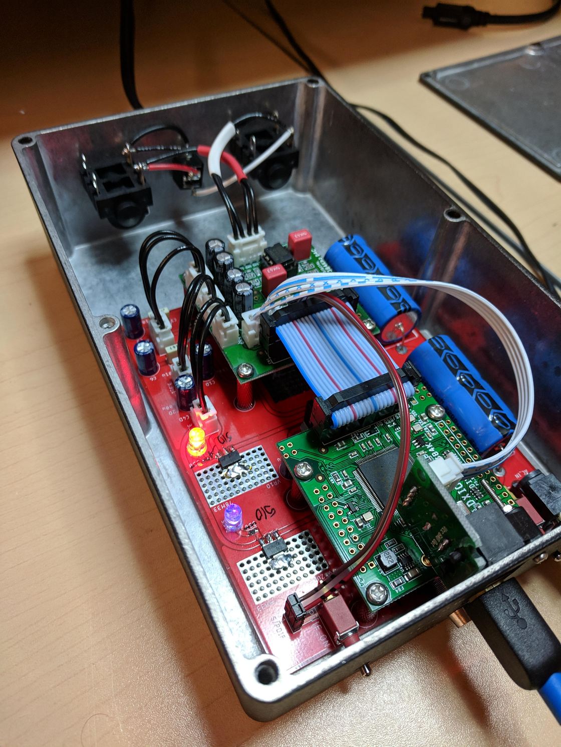 The DAC-1 opened up, showing the board inside.