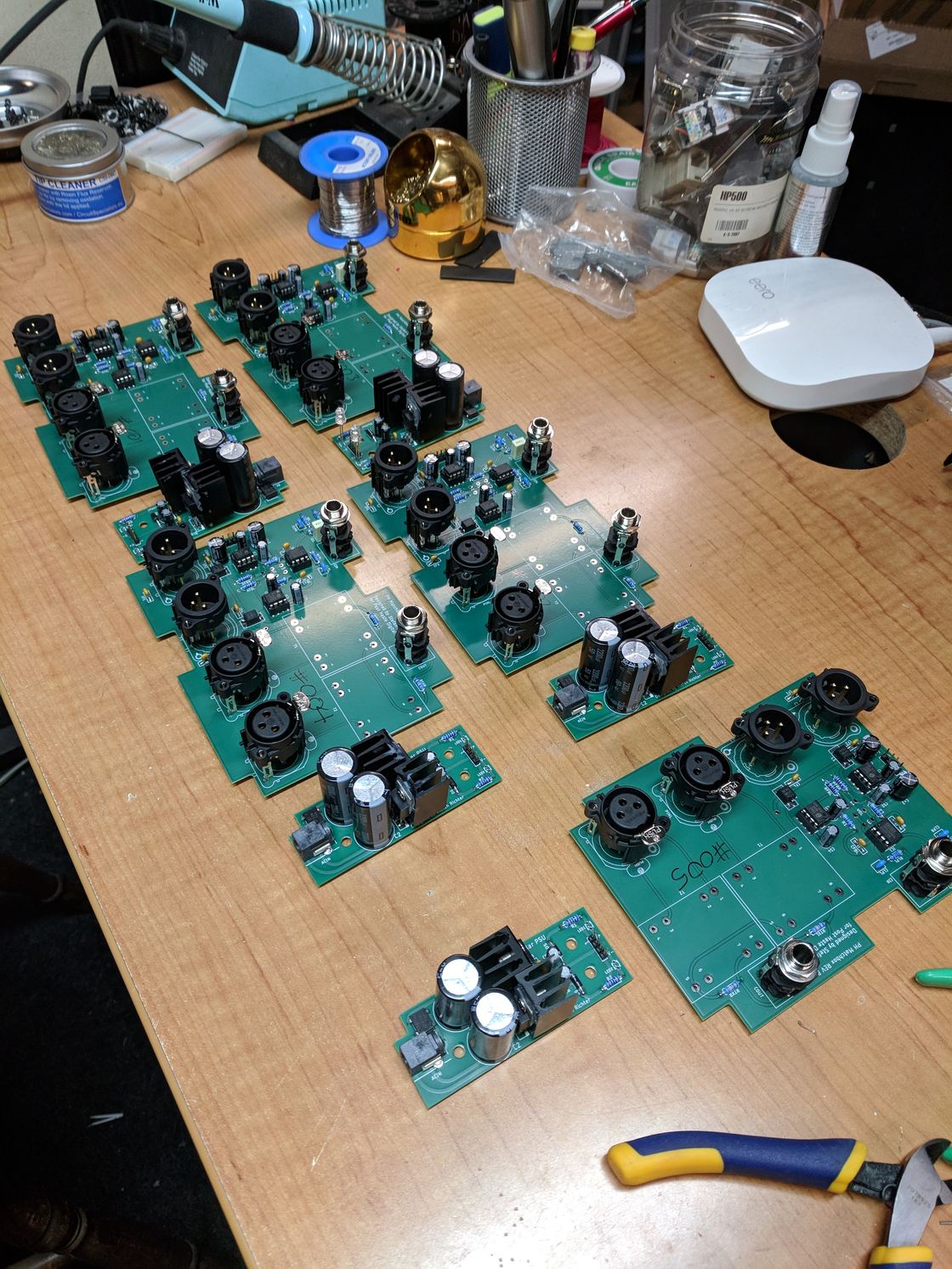 A batch of interface circuit boards under assembly.