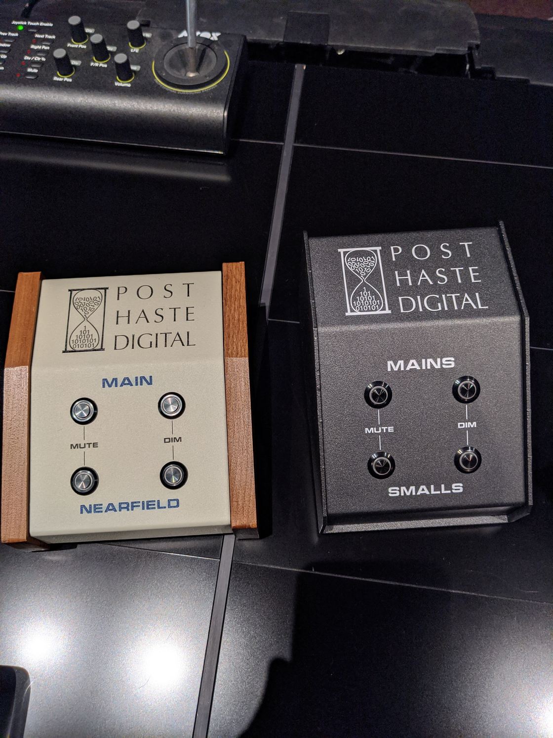 Two finished mute/dim switch units side by side.