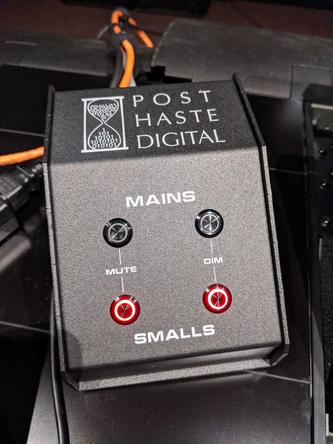 A custom mute/dim switch with its LED indicators lit.