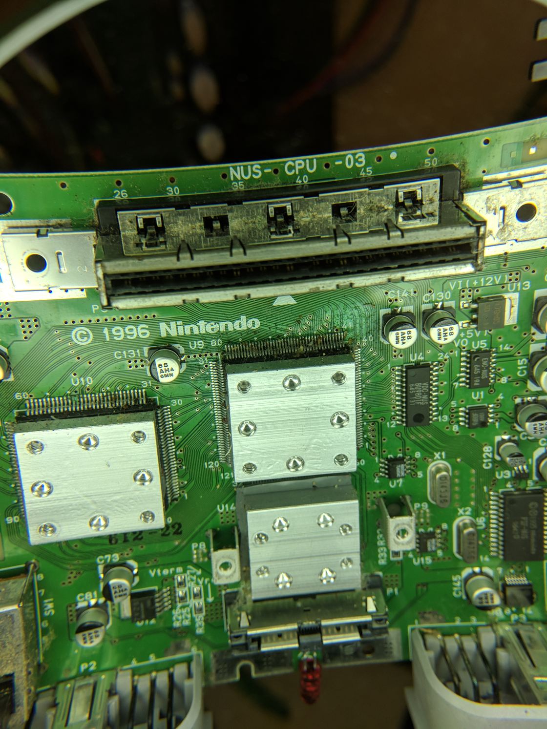 A Nintendo 64 console opened for repair.