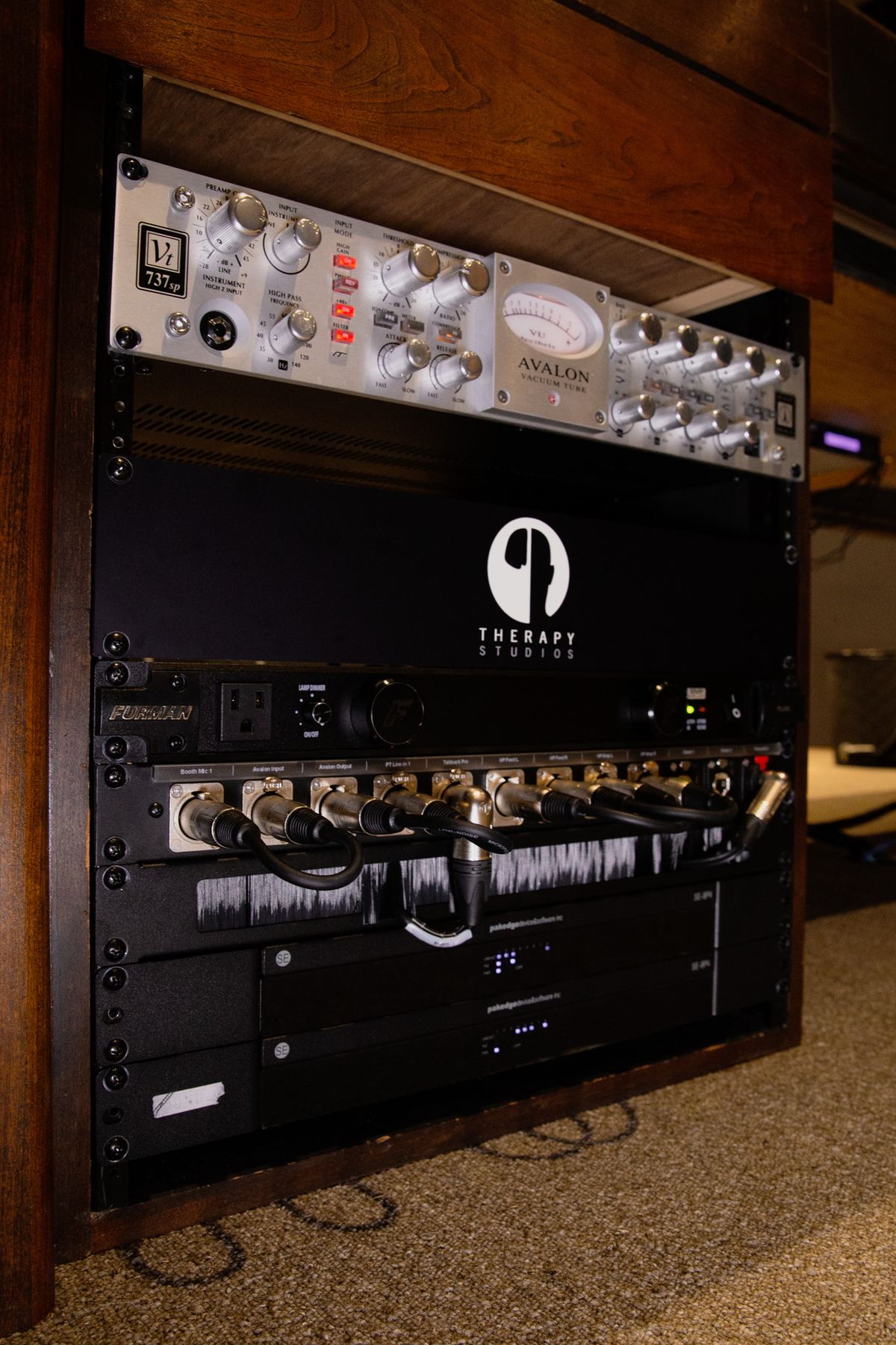 A rack front with patch panel, power conditioner and outboard.